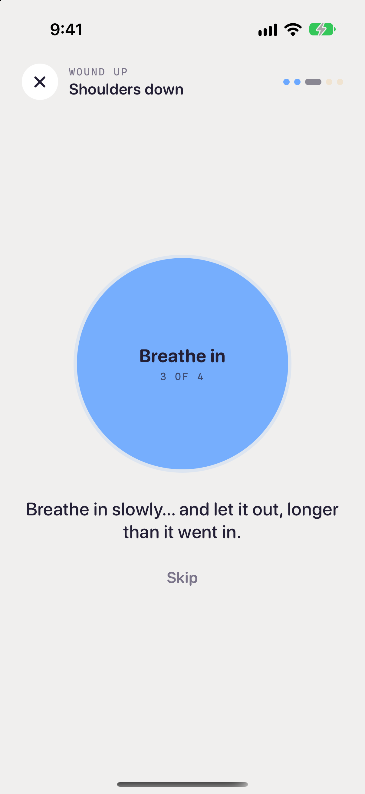 A Wound up pause called Shoulders down: a large blue circle that reads Breathe in, 3 of 4, above the words Breathe in slowly, and let it out, longer than it went in, with a Skip button.